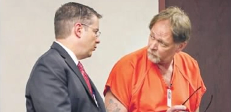 Rocky Brancato talks to an inmate about his risk protection order